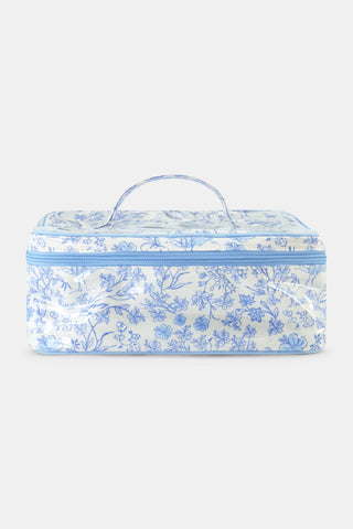 The Cherry Blossom Toile Carry All Case by Roller Rabbit is a rectangular zip-around case with a top handle, showcasing a light blue cherry blossom pattern on white fabric—perfect for organizing your essentials in style.