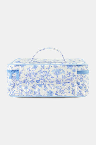 The Cherry Blossom Toile Carry All Case by Roller Rabbit is a rectangular zip-around case with a top handle, showcasing a light blue cherry blossom pattern on white fabric—perfect for organizing your essentials in style.
