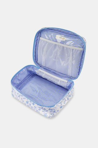 The Cherry Blossom Toile Carry All Case by Roller Rabbit is a rectangular zip-around case with a top handle, showcasing a light blue cherry blossom pattern on white fabric—perfect for organizing your essentials in style.