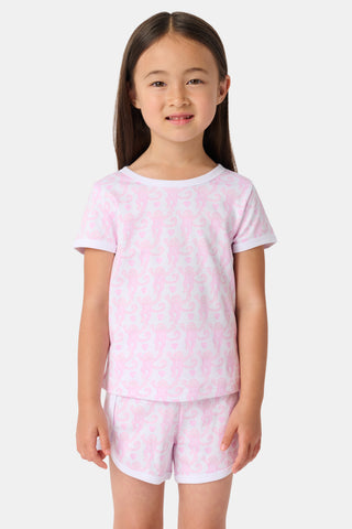 The Lovely Monkey Polo Pajamas feature a seamless pattern of pink cartoon monkeys and hearts on white, blending playful charm with the comfort of a women's short sleeve PJ set.
