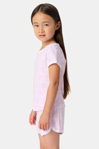 The Lovely Monkey Polo Pajamas feature a seamless pattern of pink cartoon monkeys and hearts on white, blending playful charm with the comfort of a women's short sleeve PJ set.