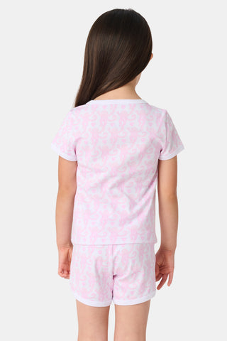 The Lovely Monkey Polo Pajamas feature a seamless pattern of pink cartoon monkeys and hearts on white, blending playful charm with the comfort of a women's short sleeve PJ set.