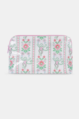The Roller Rabbit Monkey Block Stripe Makeup Bag is a white zippered pouch with pink trim, decorated with playful pink and green flowers, hearts, and monkeys for a whimsical touch.