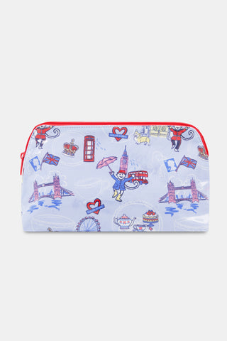 Introducing the London Monkey Makeup Bag by Roller Rabbit—a rectangular cotton canvas pouch with a light blue background, decorated with playful illustrations including Big Ben, Tower Bridge, a red double-decker bus, a crown, a teacup, and the signature monkey character holding an umbrella. Finished with a vibrant red zipper.