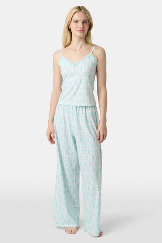 Wearing Roller Rabbit’s Monkey Monroe Pant in light blue and white heart-print cotton modal, the barefoot person stands against a white background, with only their lower torso and legs visible.