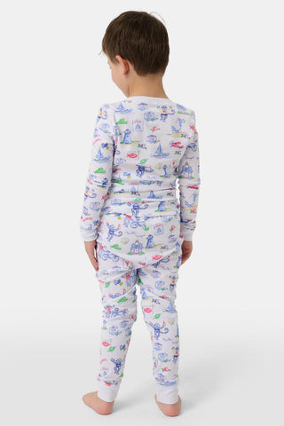 Crafted from soft Pima cotton, the Roller Rabbit Monkey On The Vineyard Long Sleeve Polo Pajamas feature a button-up long-sleeve top and long pants adorned with the playful Monkey on the Vineyard print, showcasing various animals, objects, and buildings on a plain white background.