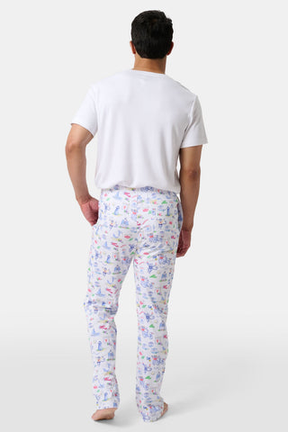 Crafted from soft Pima cotton, the Roller Rabbit Monkey On The Vineyard Long Sleeve Polo Pajamas feature a button-up long-sleeve top and long pants adorned with the playful Monkey on the Vineyard print, showcasing various animals, objects, and buildings on a plain white background.