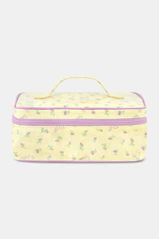 The Roller Rabbit Mini Monkey Blossom Carry All Case is a rectangular yellow toiletry bag featuring a pink floral pattern, a purple zipper, and a yellow handle on top. Displayed against a plain white background, this stylish travel bag is perfect for organizing your essentials.