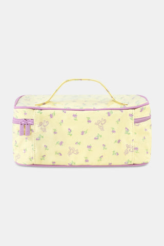The Roller Rabbit Mini Monkey Blossom Carry All Case is a rectangular yellow toiletry bag featuring a pink floral pattern, a purple zipper, and a yellow handle on top. Displayed against a plain white background, this stylish travel bag is perfect for organizing your essentials.