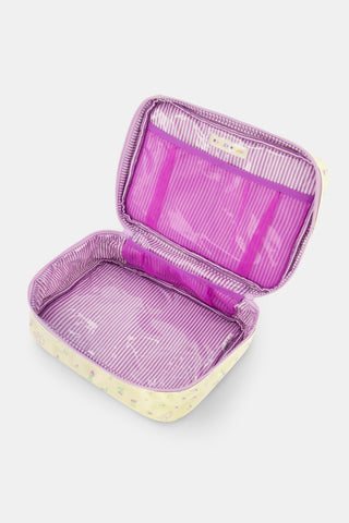The Roller Rabbit Mini Monkey Blossom Carry All Case is a rectangular yellow toiletry bag featuring a pink floral pattern, a purple zipper, and a yellow handle on top. Displayed against a plain white background, this stylish travel bag is perfect for organizing your essentials.