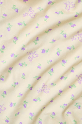 Yellow wide-leg pajama pants with a small yellow floral print pattern, crafted from a soft cotton modal blend, shown on a white background. These comfortable Roller Rabbit Mini Monkey Blossom Monroe Pants are perfect for relaxing at home.