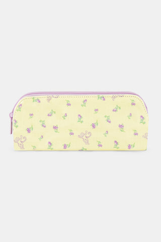 The Roller Rabbit Mini Monkey Blossom Makeup Bag features a pastel yellow cotton canvas with a curved top, adorned with small pink and green floral patterns and whimsical purple monkey line drawings. This stylish bag is perfect for storing your essentials while traveling.