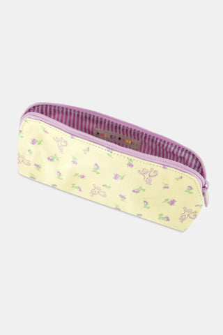 The Roller Rabbit Mini Monkey Blossom Makeup Bag features a pastel yellow cotton canvas with a curved top, adorned with small pink and green floral patterns and whimsical purple monkey line drawings. This stylish bag is perfect for storing your essentials while traveling.
