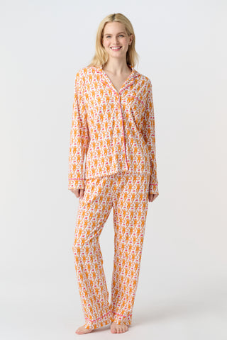 Playful orange monkeys and pink butterflies pop on a white background. The Monkey Polo Pajamas bring whimsy and color to your pima cotton collection, making this matching set a standout favorite for fun, lively sleepwear.