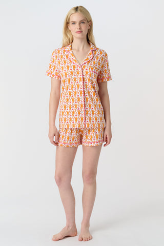 Playful orange monkeys and pink butterflies pop on a white background. The Monkey Polo Pajamas bring whimsy and color to your pima cotton collection, making this matching set a standout favorite for fun, lively sleepwear.