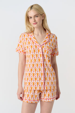 Playful orange monkeys and pink butterflies pop on a white background. The Monkey Polo Pajamas bring whimsy and color to your pima cotton collection, making this matching set a standout favorite for fun, lively sleepwear.