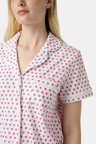 The Hearts Mischa Set is made from white Pima cotton with small, outlined pink hearts and a softly wrinkled texture, creating gentle shadows—perfect for cozy loungewear.