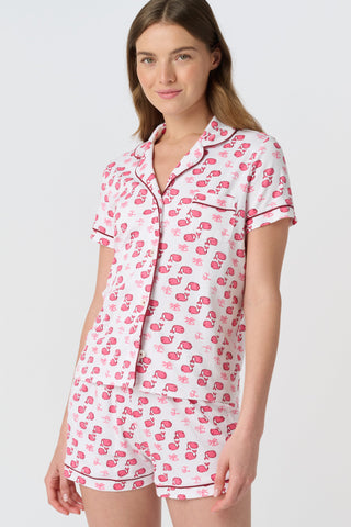 The Moby Polo Pajamas feature a playful pink whale and palm tree pattern on soft Pima cotton, making these women’s short sleeve pajamas a charming choice for fans of tropical whale print sleepwear.