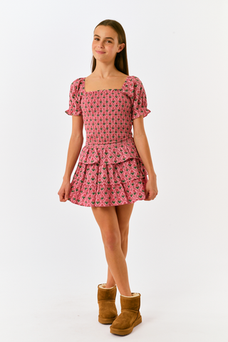 Kids Mia Floral Sami Skirt, a matching pink floral crop top and ruffled mini skirt with a smocked waistband.