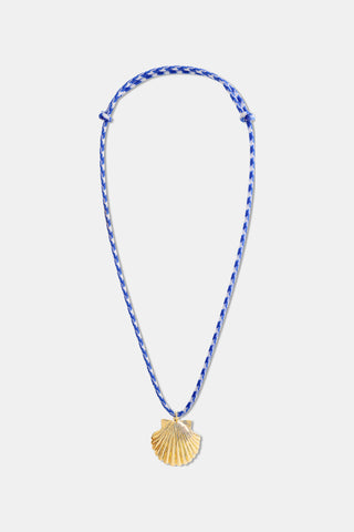 The Roller Rabbit Seashell Cord Necklace features a blue and white braided cord with a gold shell pendant. Adjustable in length, this stylish piece is perfect for any look and is shown on a plain white background.