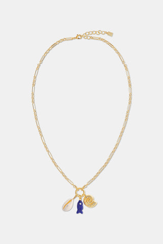 Roller Rabbit’s Coastal Charm Necklace features a gold-tone chain with three charms—a white seashell, blue fish, and gold spiral shell—capturing seaside style. Displayed on a plain white background, it's perfect for beach jewelry lovers.