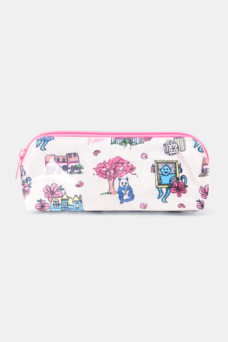 The Georgetown Monkey Makeup Bag by Roller Rabbit is a white cotton canvas pouch with a pink zipper, decorated with colorful houses, trees, flowers, and playful animal illustrations.