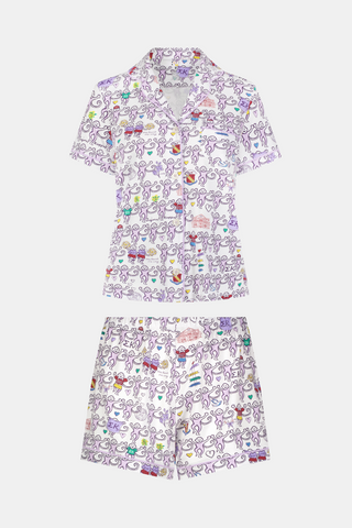 The Sigma Kappa Monkey Polo Pajamas by Roller Rabbit are a short-sleeve pajama set featuring matching shorts with a white background and colorful cartoon character pattern. Designed for comfort, they include a front button placket and an elastic waistband.