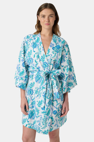 The Amanda Loungewear pajama set features white cotton fabric adorned with blue and turquoise floral and botanical patterns, adding a charming, intricate touch to women’s sleepwear.