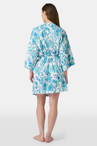 The Amanda Loungewear pajama set features white cotton fabric adorned with blue and turquoise floral and botanical patterns, adding a charming, intricate touch to women’s sleepwear.