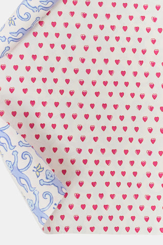 Roller Rabbit Monkey/Hearts Wrapping Paper featuring a double-sided repeating pattern of small pink hearts and a light blue design of monkeys and flowers, perfect for holiday gifting.